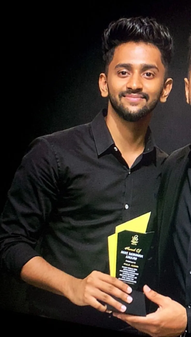 Founder holding an award